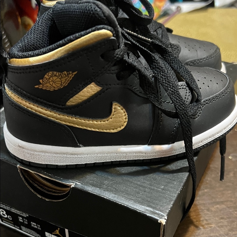 Nike Black and Gold High-Top Sneakers
